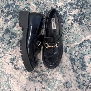 Steve Madden “Lando” Glossy Black Leather Loafers with Gold Accent